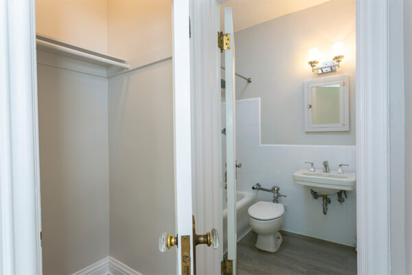Hallway with doors to closet and bathroom.