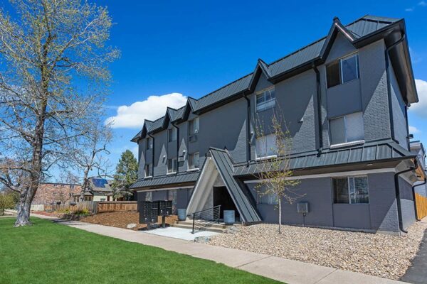 960 Logan exterior with grey brick construction and A-frame elements.