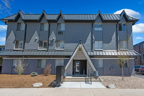 960 Logan exterior with grey brick construction and A-frame elements.