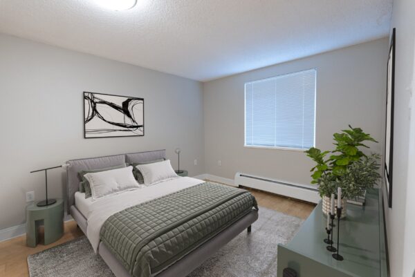 one bedroom with dresser and large window