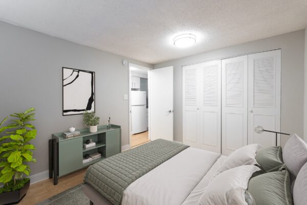 one bedroom apartment with dresser and closet