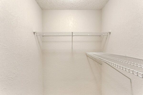 Spacious closet with wire shelves.