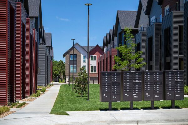 Dayton Station townhomes courtyard with lush green lawns and mailboxes.
