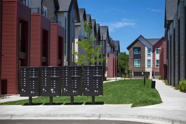Dayton Station townhomes courtyard with lush green lawns and mailboxes.