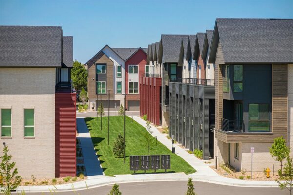 Dayton Station townhomes courtyard with lush green lawns and mailboxes.