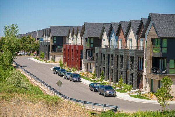 Dayton Station townhomes with three story construction, balconies, ample street parking, and nearby open space.