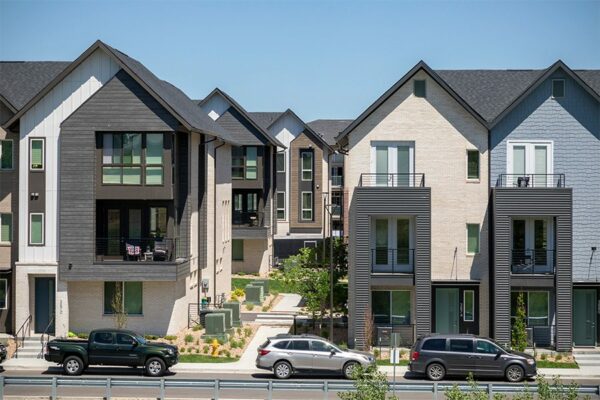 Three story Dayton Station townhomes with ample street parking and balconies.