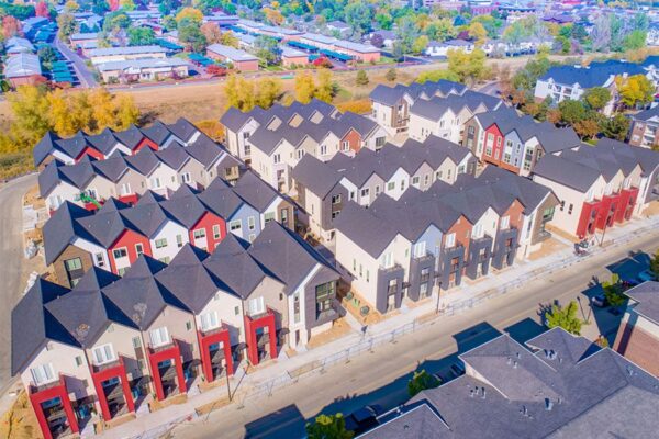 Aerial view of Dayton Station townhomes with 3 story construction and ample street parking.