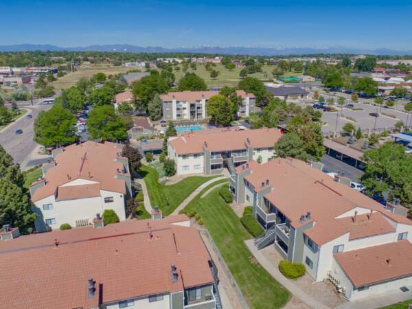Aerial view of Hadley apartments with ample parking and lush landscaping.