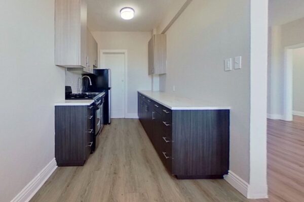 kitchen with two counters and entry to living room
