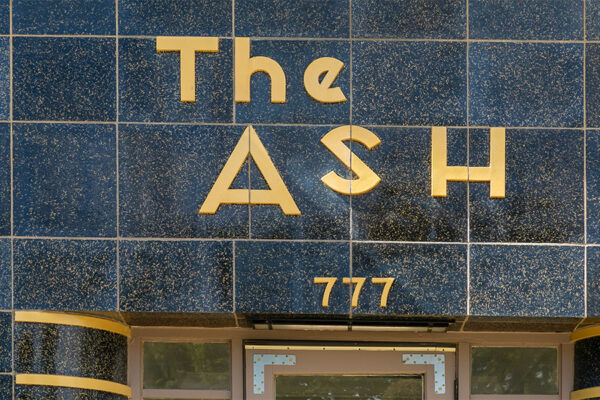 The Ash art deco style tiled monument sign.
