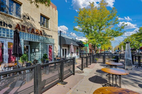 The Arvada Tavern patio with outdoor seating and heaters.