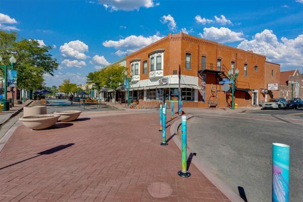 Olde Town Arvada with stone sidewalks and classic brick buildings.