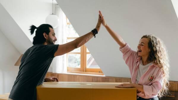 two people high fiving