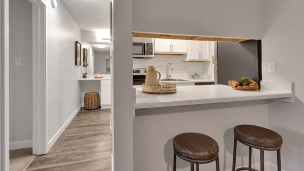 breakfast nook view into kitchen and bathroom in the backgound
