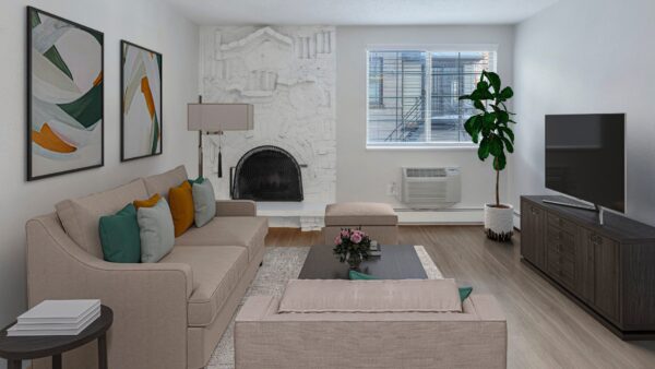 living room with couch, brick fire place, and coffee table