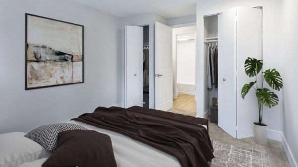 one bedroom apartment with large bed and en suite bathroom