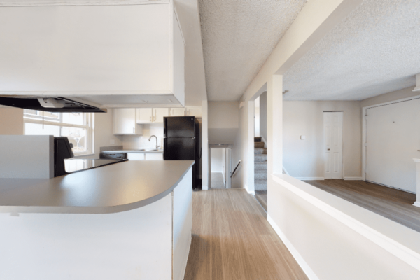 kitchen, living room, and stairs of four bedroom townhome