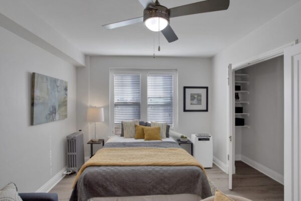 full sized bed in a studio apartment