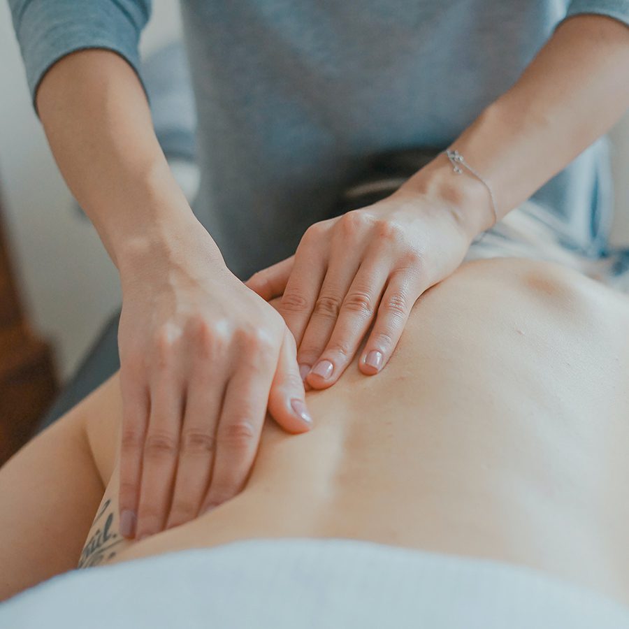 Person receiving a massage at a spa.