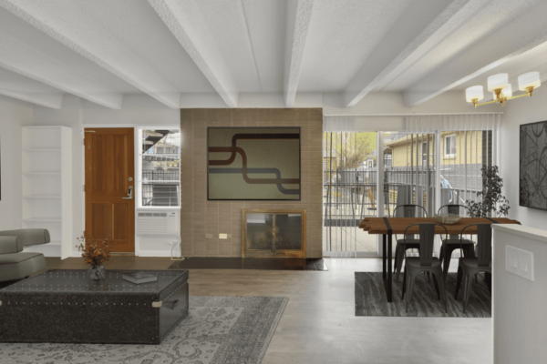 living room with fire place and large patio entrance to the pool