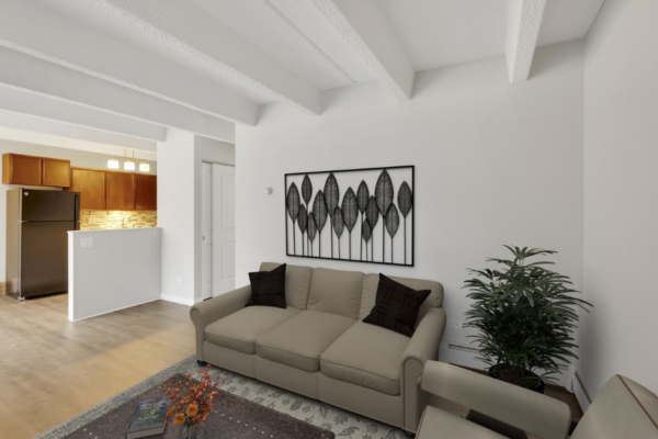 living room with couch and view of kitchen