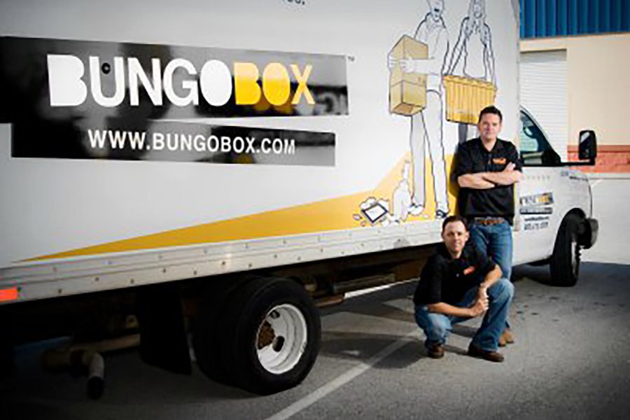 Bungo Box moving truck with movers in polo shirts and jeans.