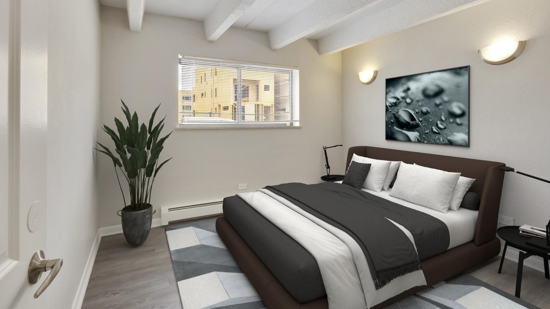 one bedroom apartment with king size bed, night stands and large window