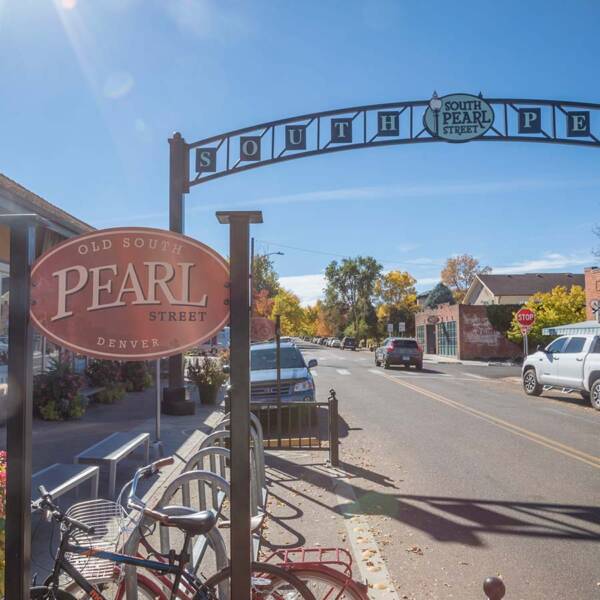 South Pearl Street with restaurants and cars parked on the side.