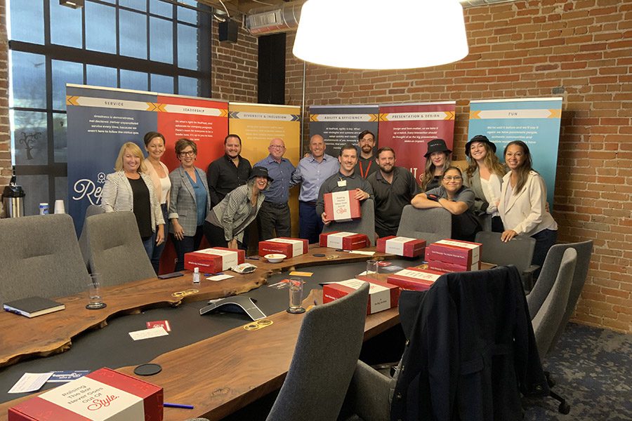 RedPeak team members gathered in office for rollout of new corporate branding.