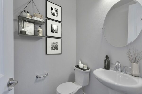 Rendering of a powder room with white walls.