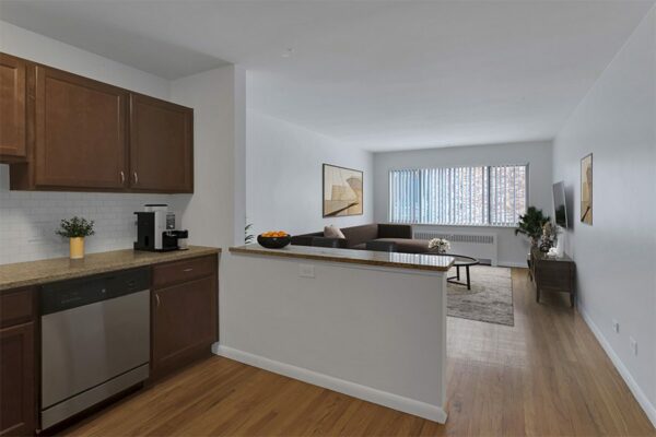 Kitchen with wood floors, dark wood cabinets, and a peninsula.