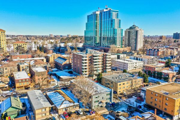 Aerial view over 25 Emerson apartments looking east toward large tower block.