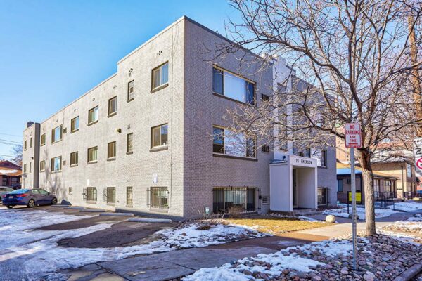 25 Emerson with grey brick construction, classic mid century style, and ample parking.