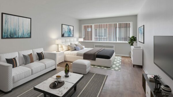 Studio apartment with bed and living room area.