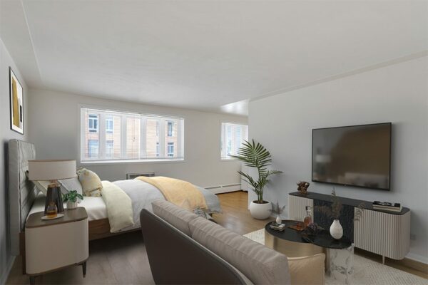 Rendering of a bedroom with wood floors, white walls, and a seating area.