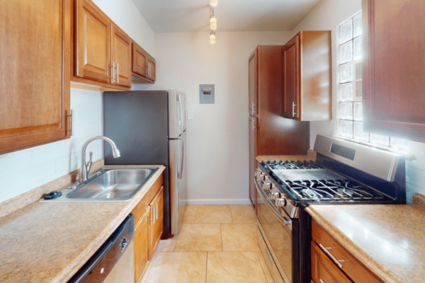 kitchen view with oven, stove, and cabinets