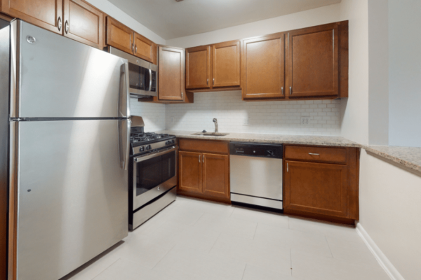 kitchen with wood cabinets, steel appliances and counter top