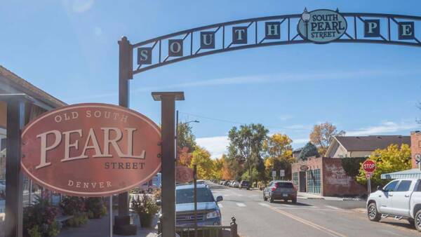 South Pearl Street with restaurants and cars parked on the side.