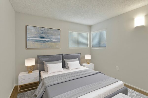 Rendering of a bedroom with a carpet over wood floors, white walls, and two windows.