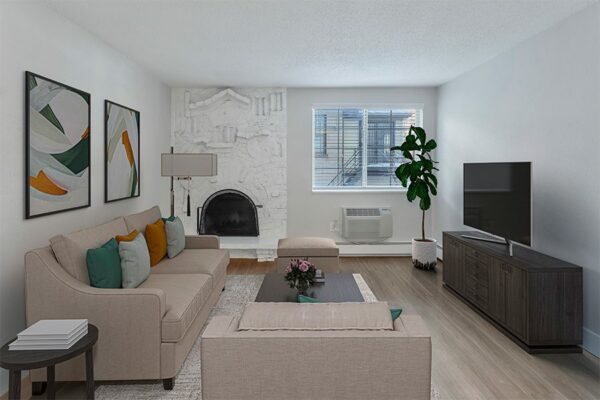 Rendering of a living room with wood floors covered by a carpet, white walls, and a fireplace.