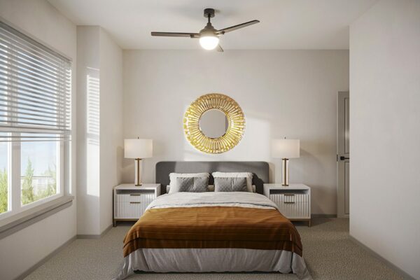 Bedroom with plush bed, bedside tables with lamps, and large window.