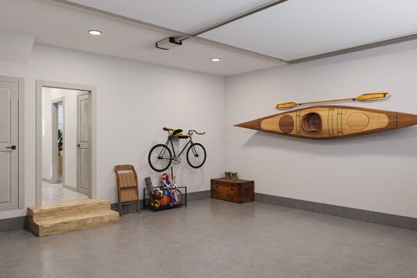 Rendering of townhome garage with outdoor equipment and warm lights.