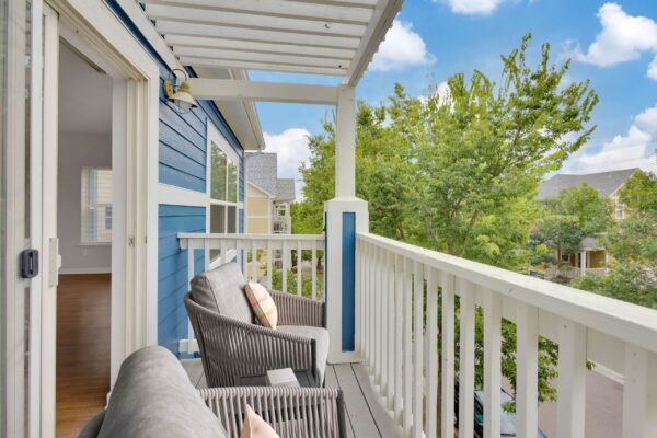 patio with blue exteriors and two lounge chairs