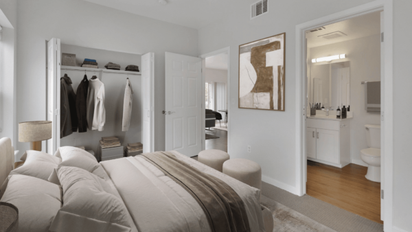 bedroom with one bed, closet, and view into bathroom