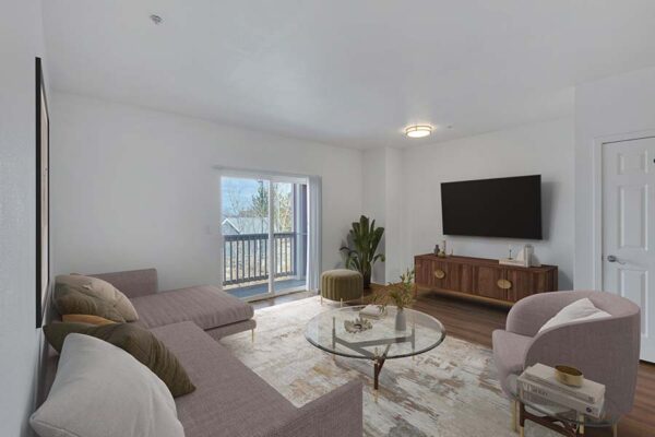 Trocadero apartment living room with rug, plush sectional and seating, console, TV, and balcony door.