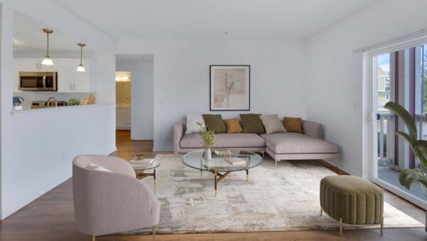 Trocadero apartment living room with rug, plush seating, modern furniture, and balcony door.