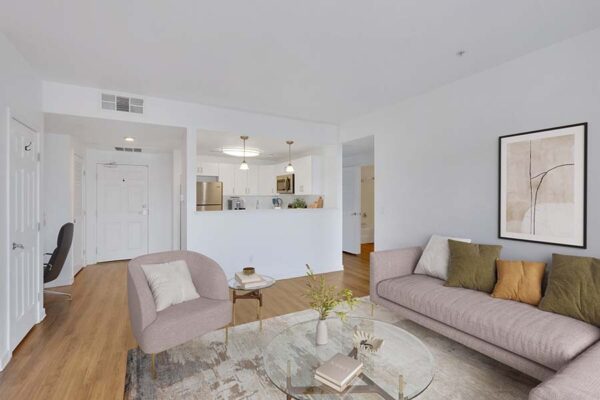 Trocadero apartment living room with rug, plush seating, modern furniture, and framed artwork.