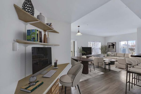 Trocadero apartment living room with plush seating, computer desk, and shelves with decor.