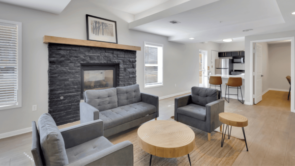 clubroom with tv, fire place, and kitchen
